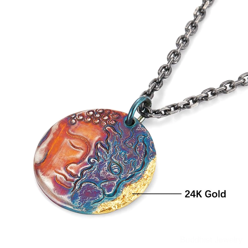 Close-up detail of sterling silver Buddha demon pendant showing 24K gold-trimmed edge and precision dual-face engraving, professional macro photography