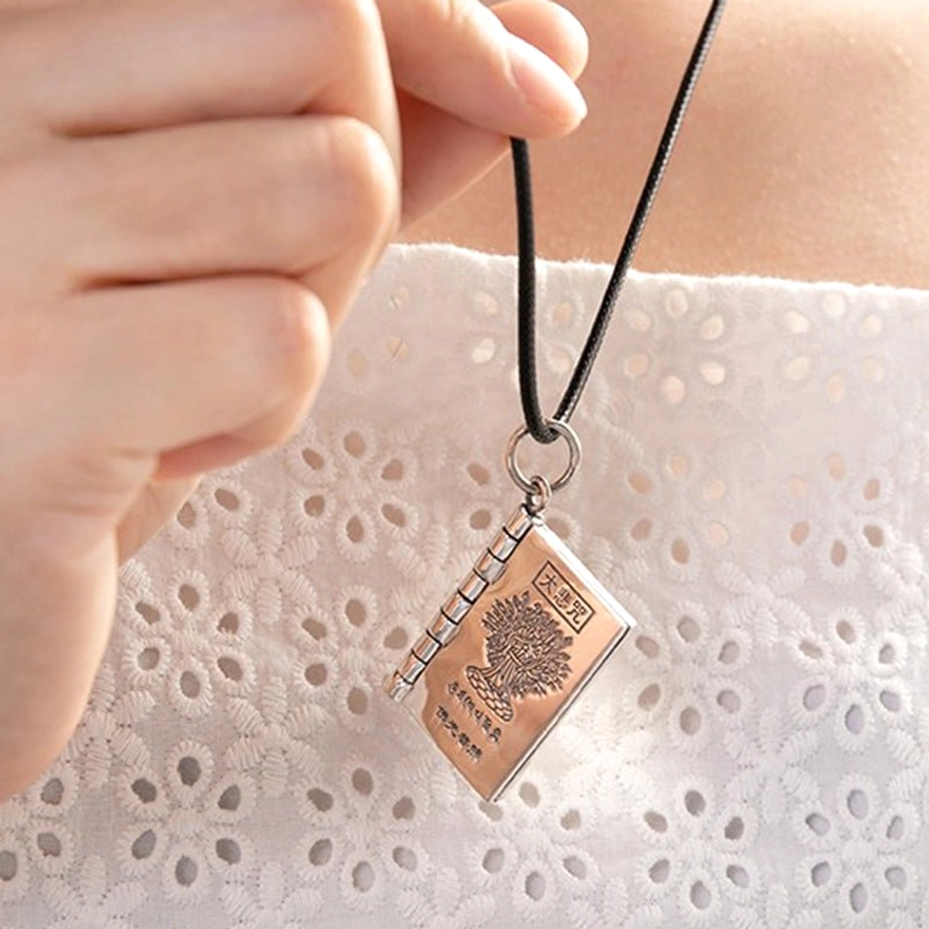Sterling silver Buddhist sutra pendant necklace with lotus symbol and sacred mantra engraving for protection and spiritual practice