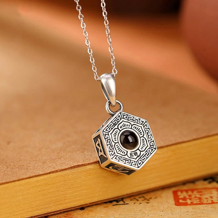 Handcrafted Sterling Silver Buddhist Necklace with Sanskrit Engravings and Vintage Silver Finish - Oblique Angle Detail