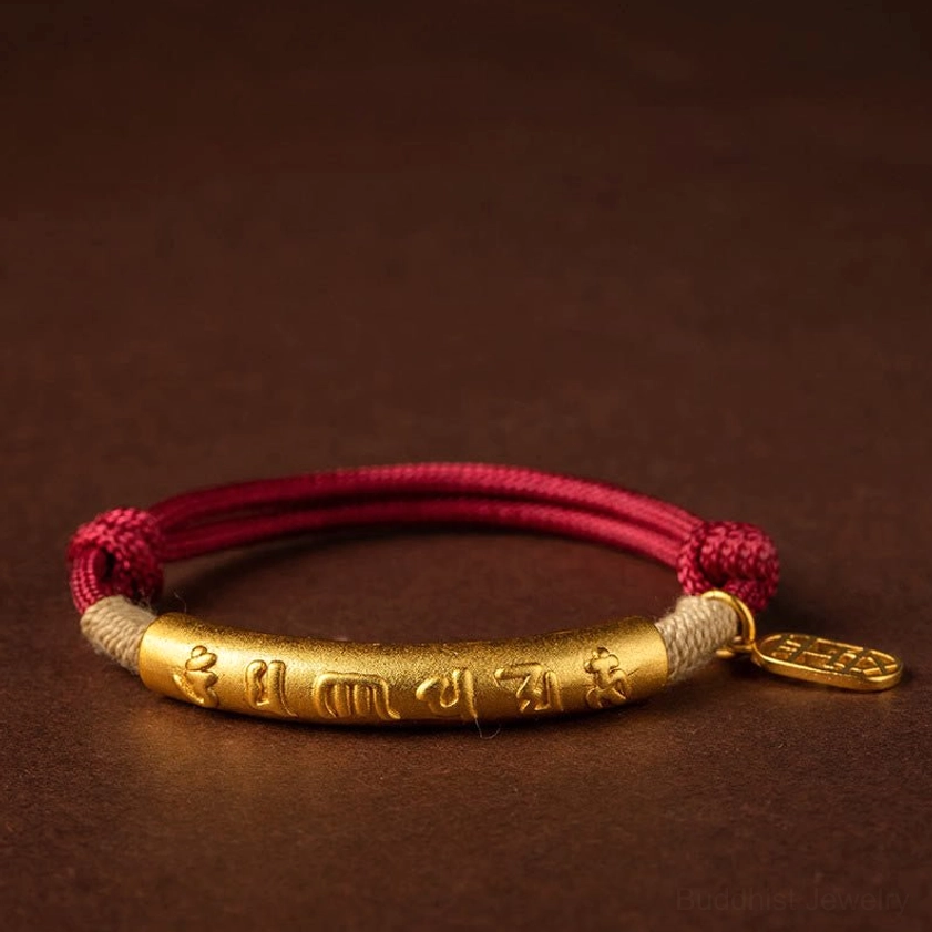 Close-up detail of embossed 999 sterling silver Fu character charm pendant Buddhist bracelet