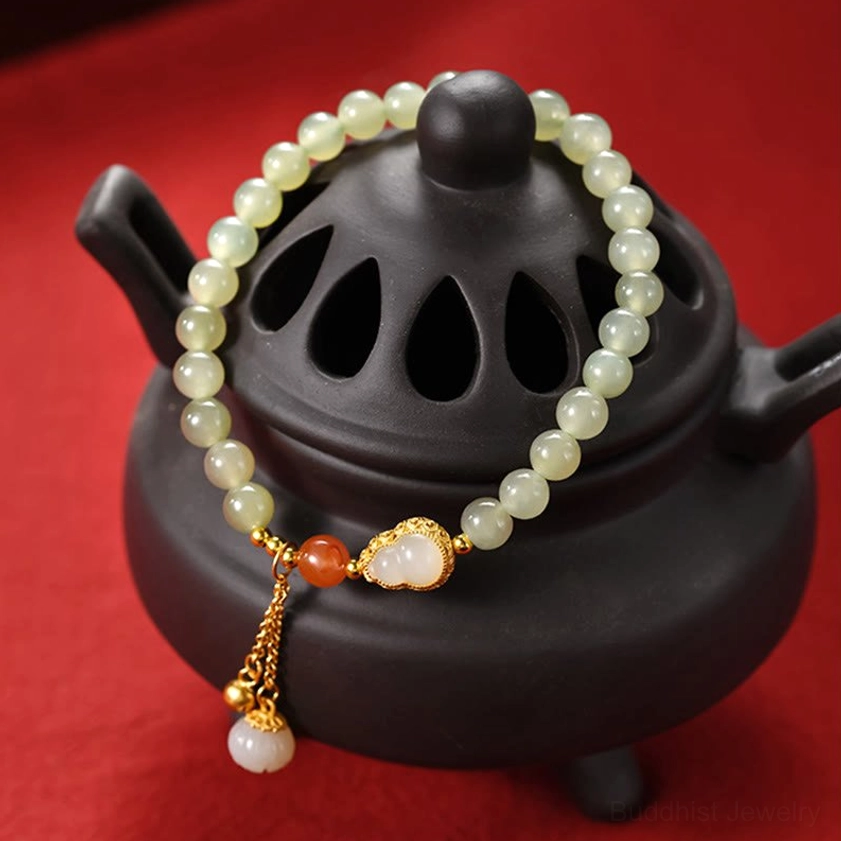 925 sterling silver hetian jade beaded bracelet with gold gourd charm three-quarter view