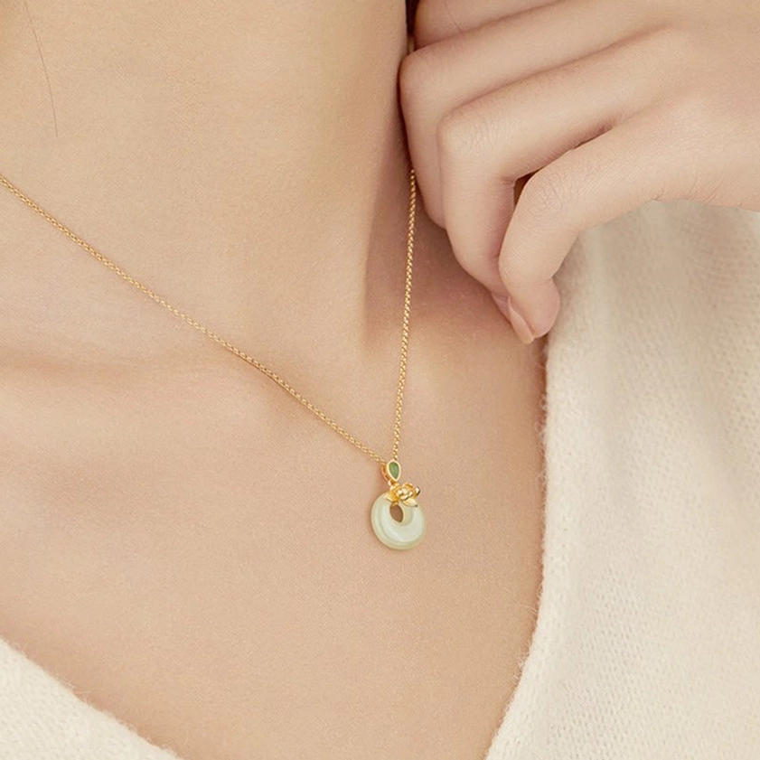 Sterling silver jade pendant necklace on neck, side close-up worn styling