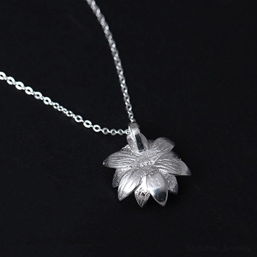 Sterling silver lotus pendant necklace without center gemstone, side view highlighting intricate detailed silver petal craftsmanship on black background