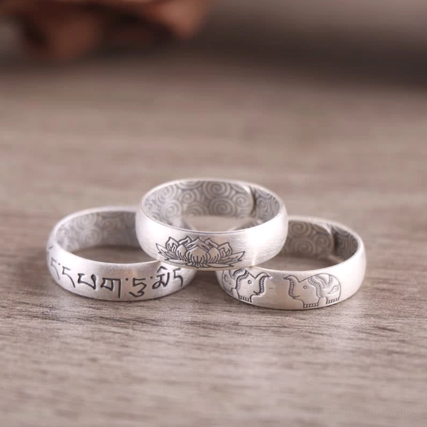 Handmade silver blessing ring featuring engraved Sanskrit six true words mantra, lotus and elephant motifs with inner cloud texture