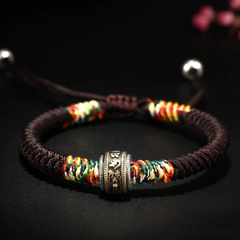 Brown rope Buddhist bracelet with sterling silver Om Mani Padme Hum beads and King Kong Knot amulet
