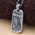 Sterling silver Om Mani Padme Hum wealth goddess pendant necklace with engraved mantra, front oblique view