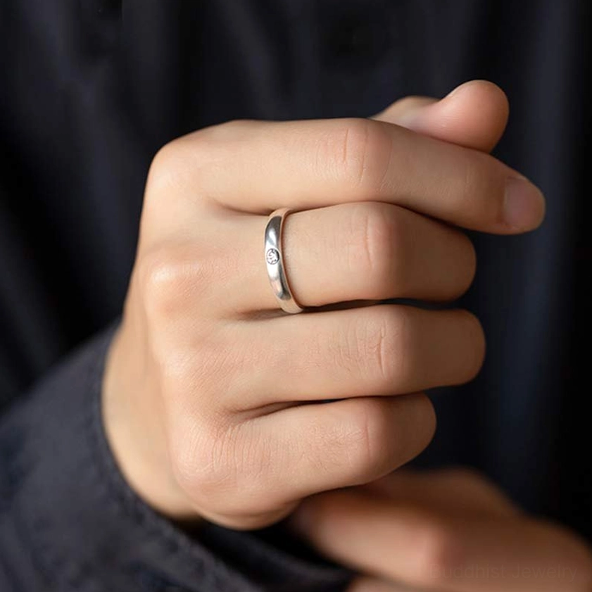 Sterling silver zodiac ring with smooth slim band, side view worn on hand