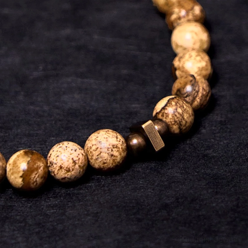 Natural speckled stone beads with square copper spacer and round copper beads detail shot