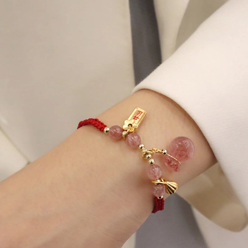 Side View of Strawberry Quartz Lotus Bracelet on Wrist - Delicate Gold Metal Components