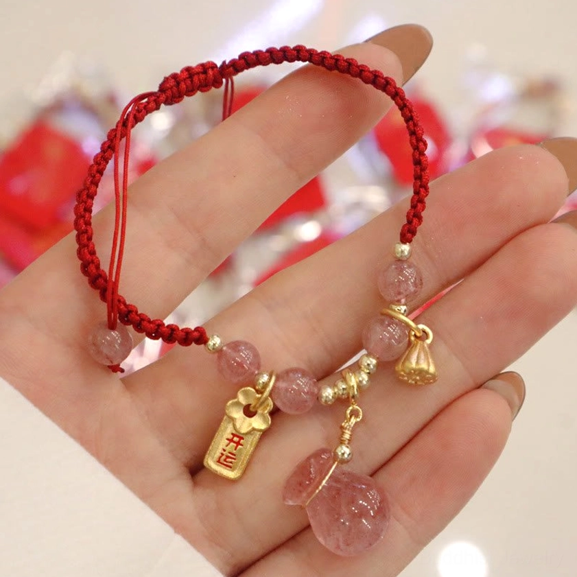 Full Handcrafted Red String Bracelet with Strawberry Quartz and Spiritual Charms - Palm Display