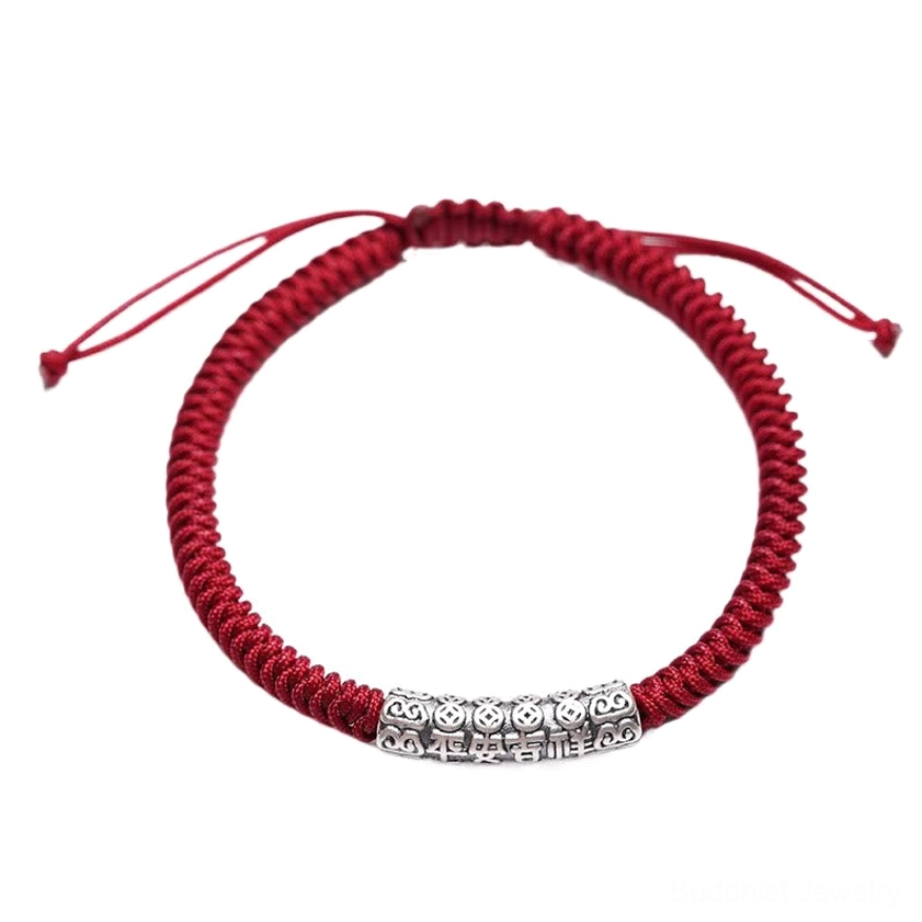 Close-up of adjustable dark red string bracelet showing knot closure and silver bead design