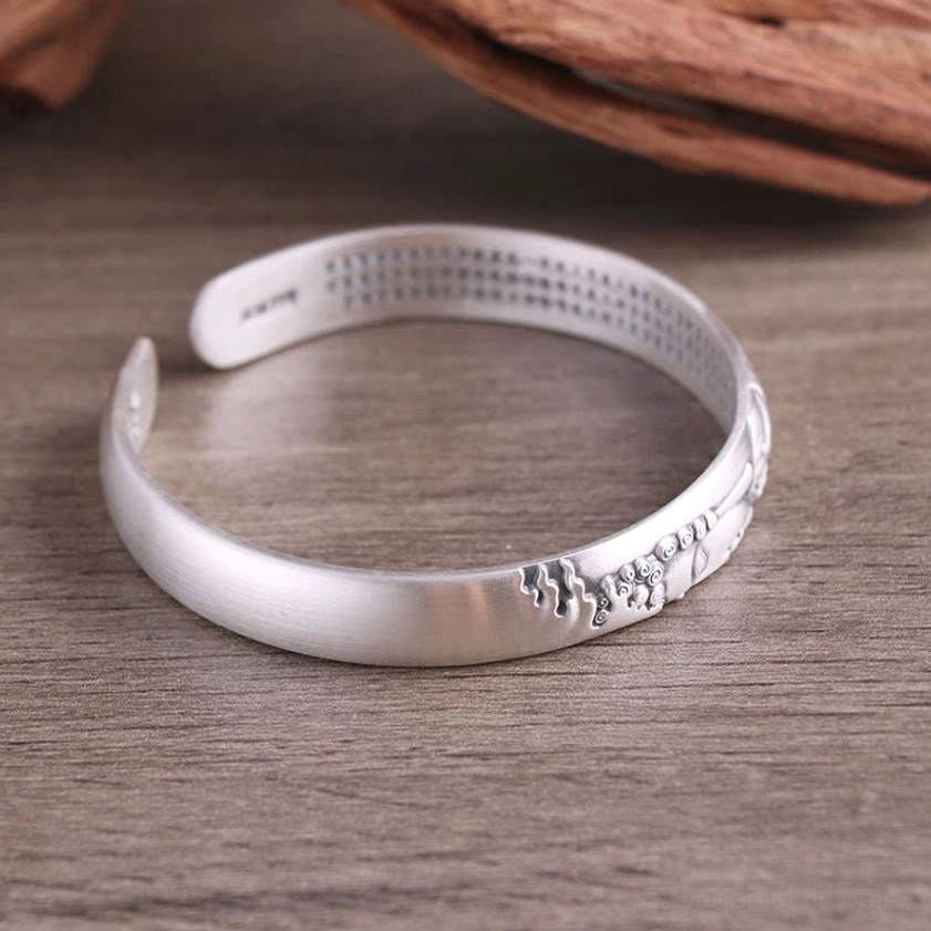 Eco-friendly 999 sterling silver Buddhist Buddha bracelet with Heart Sutra engravings, sustainable handmade jewelry for spiritual seekers and mindfulness practitioners