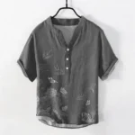 Swallow lotus buddhist mens henley shirt steel blue front view with stand collar and 3-button placket