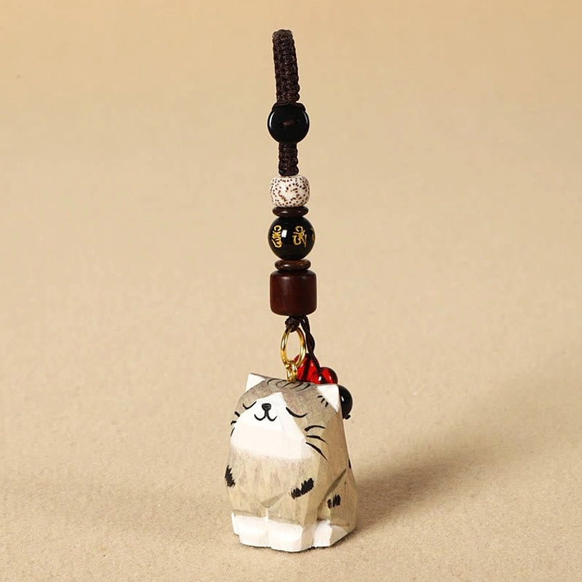 Tabby cat Om Mani Padme Hum wooden keychain variant three-quarter angle view with mantra significance
