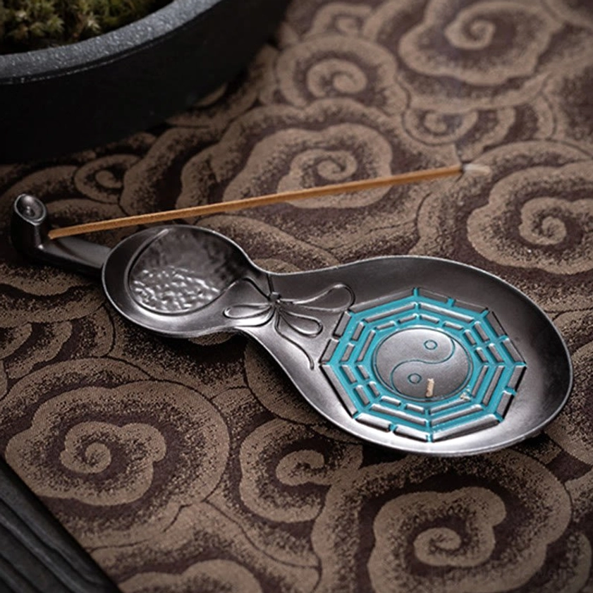 Tai Chi Bagua copper incense burner with lit incense creating fragrant smoke for spiritual practice