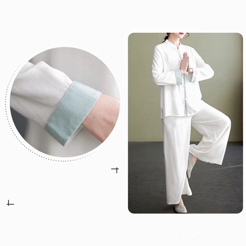 Tai chi top cuff detail showing light blue contrast trim and soft cotton linen texture