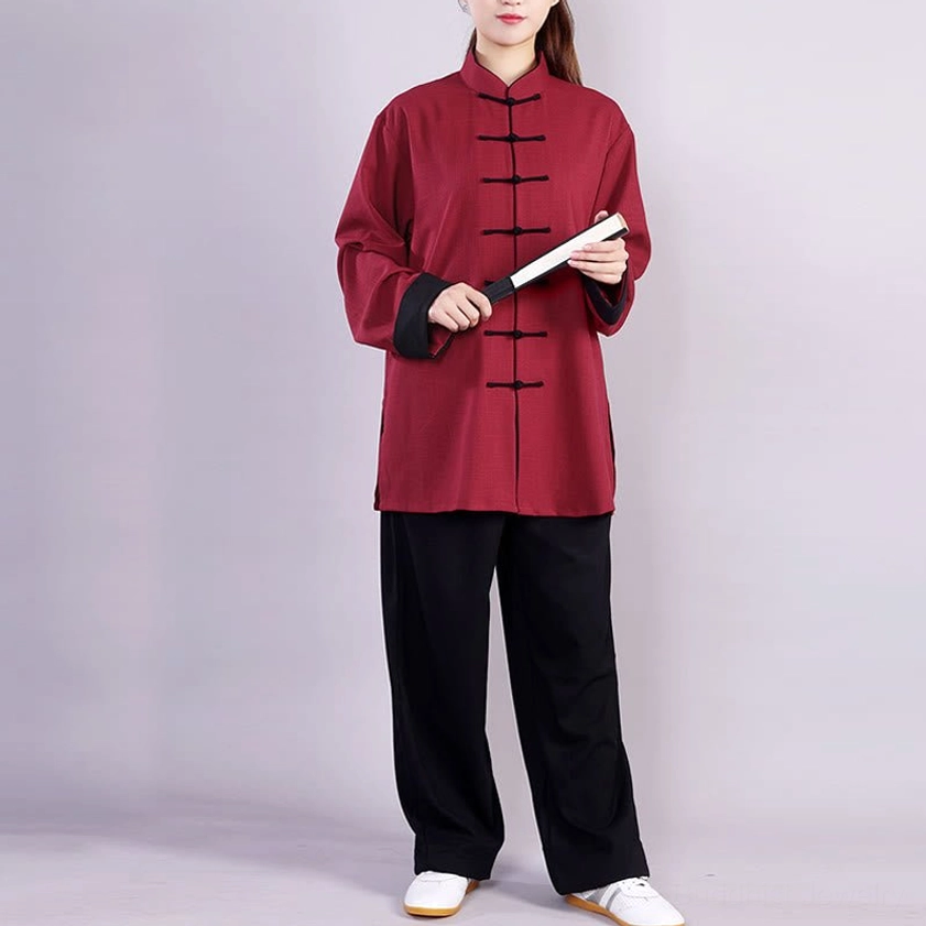 Unisex tai chi practice set burgundy cotton-linen top with black frog buttons, paired with holding fan accessory
