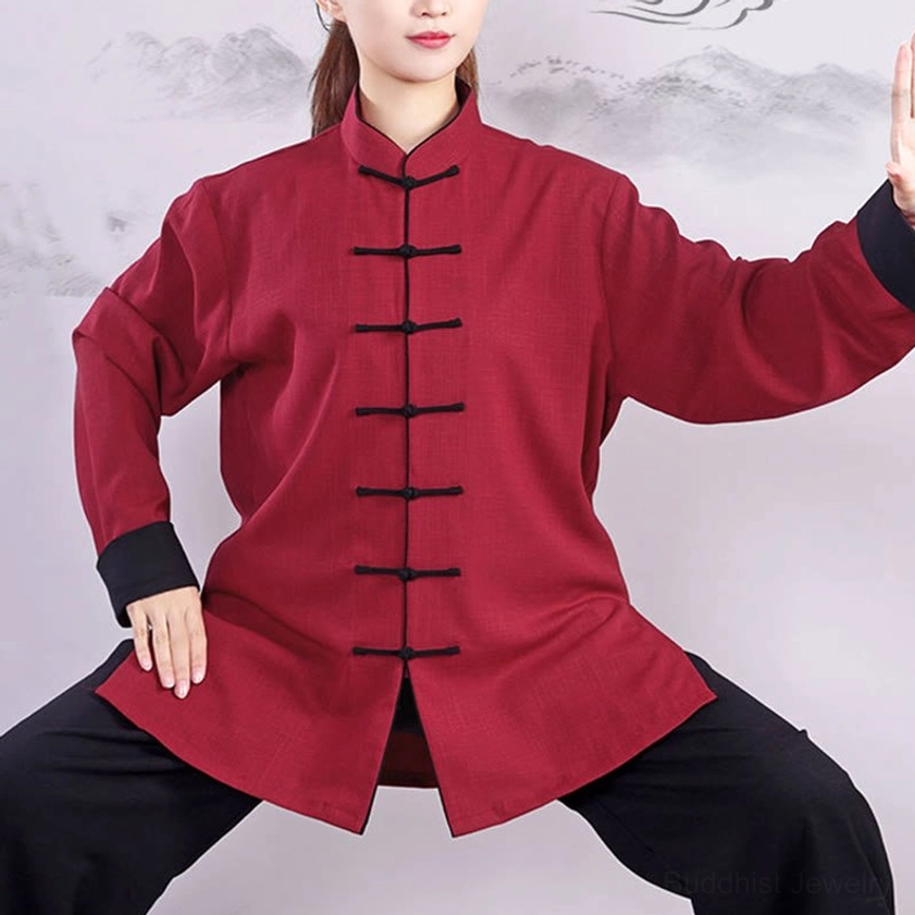 Close-up tai chi practice top with black frog buttons and mandarin collar, red linen-cotton fabric detail