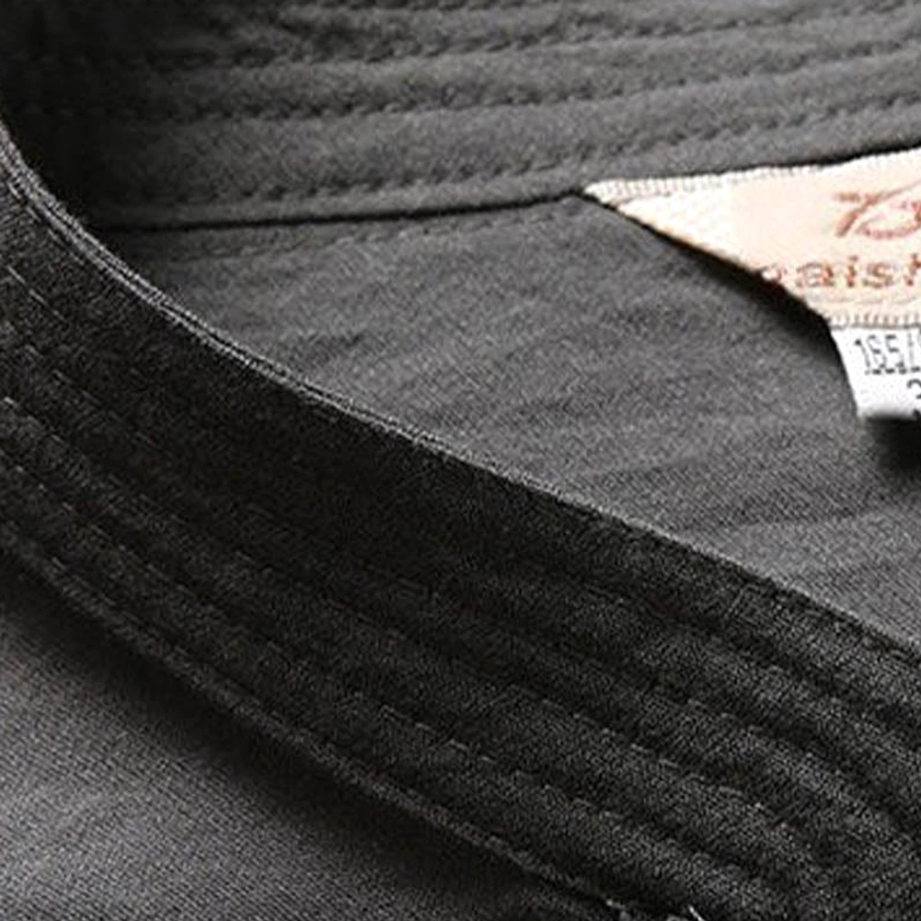 Close-up detail of tang suit stand collar with dense stitching and brand tag - traditional Chinese craftsmanship