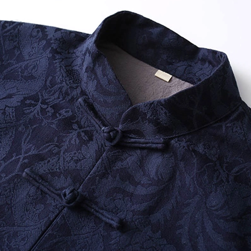 Tang suit jacket stand collar and front frog button detail - close-up of traditional Chinese closure system and navy vine pattern