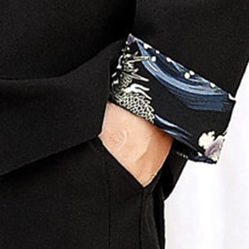 Tang suit sleeve cuff close-up - traditional Chinese woven pattern with contrast cuff design