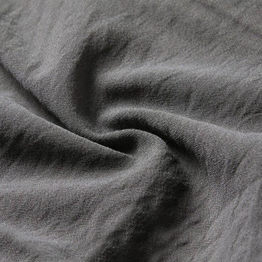 Tang suit fabric texture - soft wrinkled polyester with matte cotton linen appearance - flat lay close-up