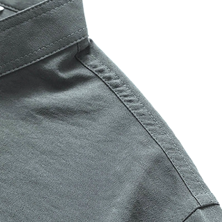 Macro detail of grey Tang suit shoulder seam and premium linen-cotton woven fabric texture