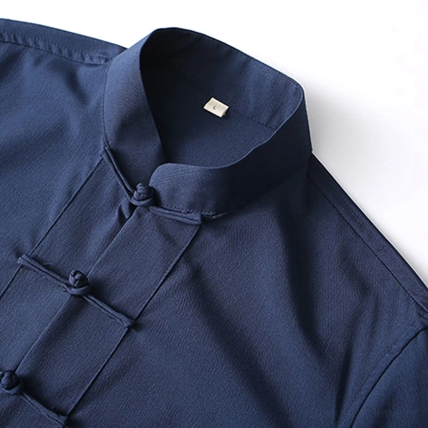 Close-up detail of tang suit shirt collar and front frog button fasteners with neat stitching