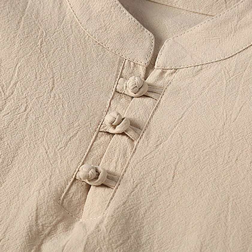 Close-up detail of Tang suit frog button stand collar and Chinese traditional closure