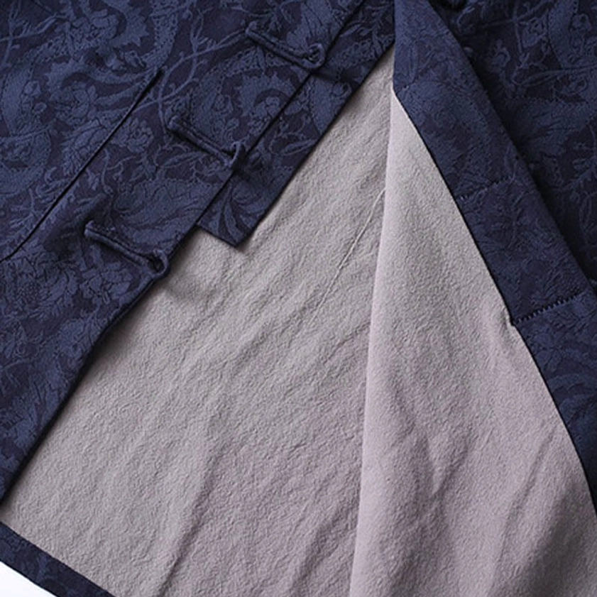 Tang suit jacket inner lining with grey contrast detail and frog button fastener close-up