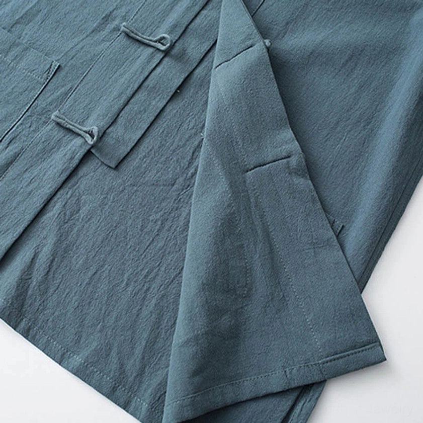 Tang suit inner placket and hidden frog button detail with side seam construction