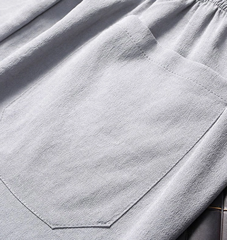 Tang suit drawstring waist pants - elastic waistband detail showing adjustable cord for comfortable fit on navy straight leg pants