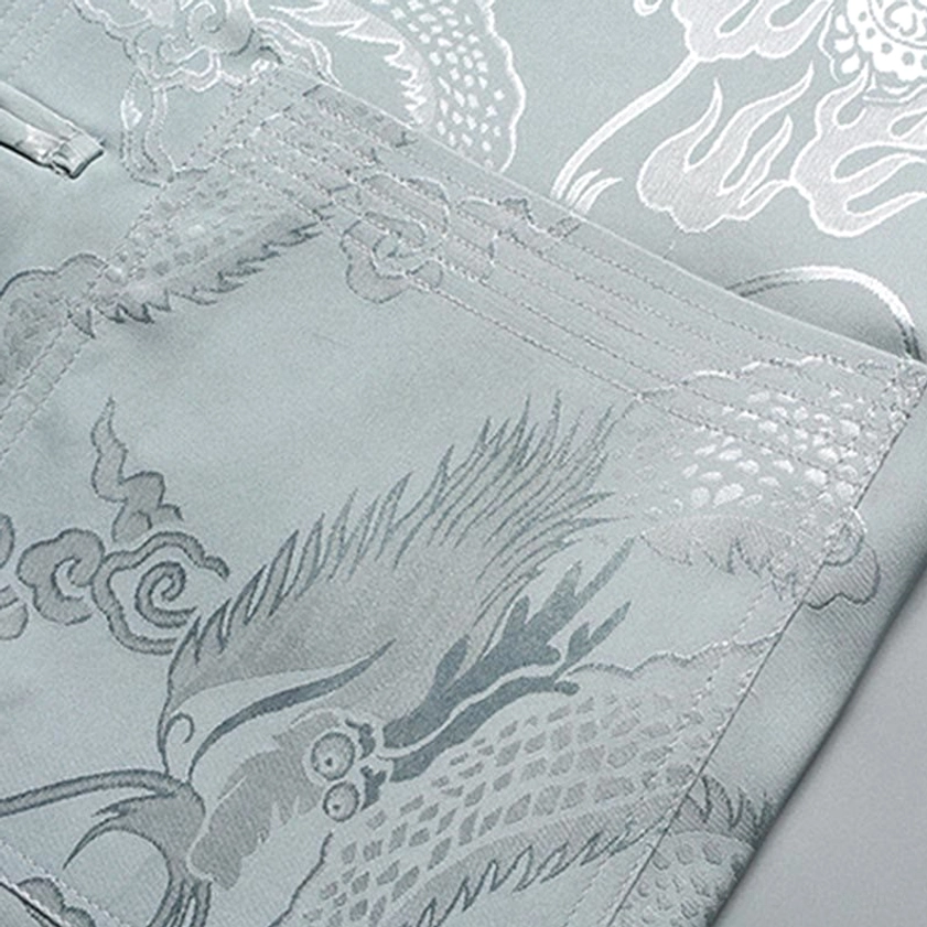 Dragon jacquard pattern and slanted pocket detail on Tang suit top