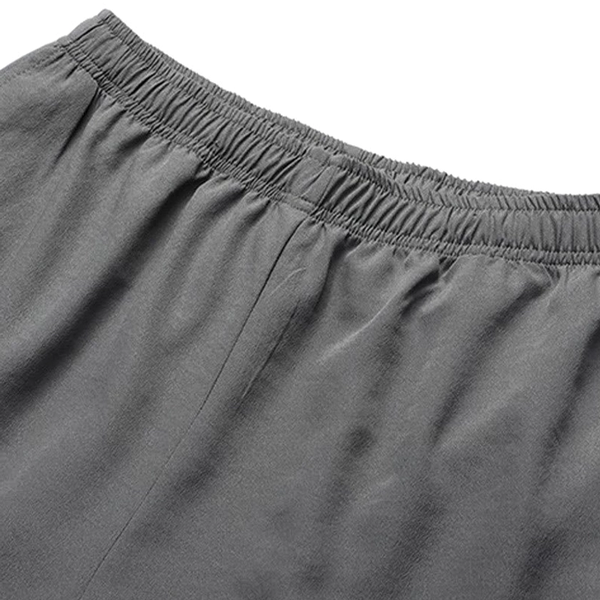 Tang suit fabric texture and weave detail showing premium polyester material quality and breathable construction