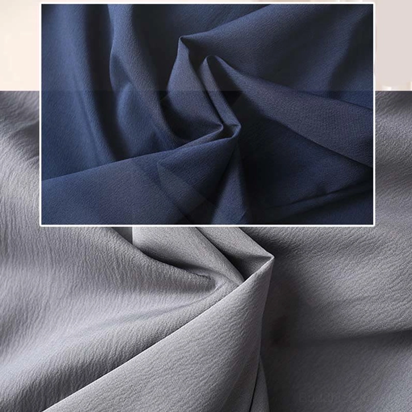 Tang suit fabric texture detail showing lightweight polyester weave and matte finish