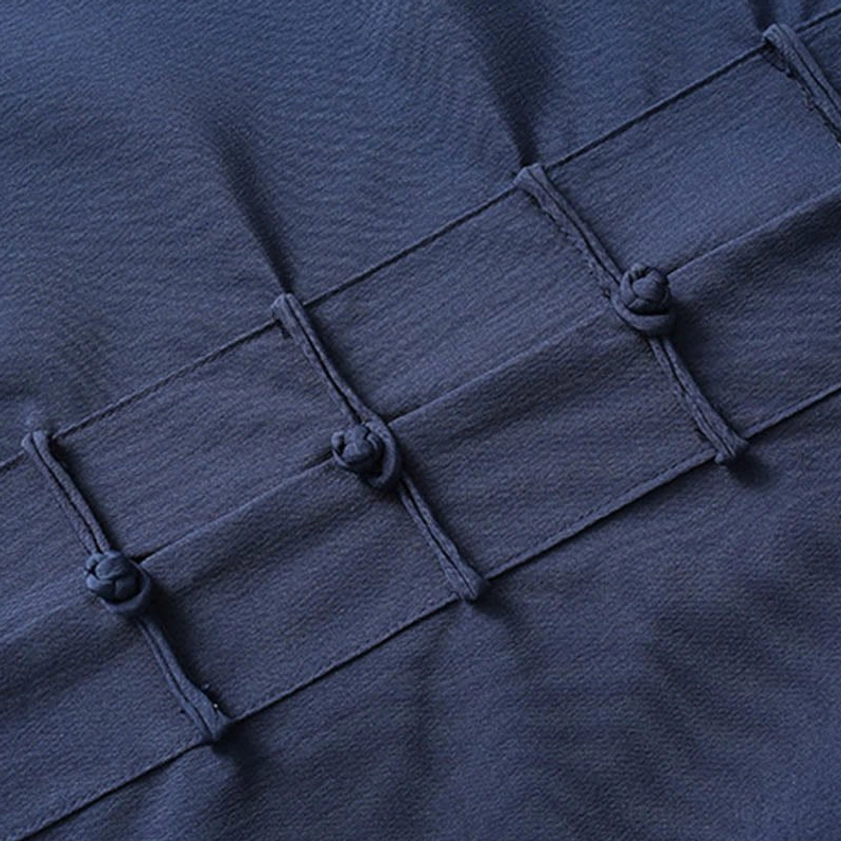 Tang suit shirt front placket showing traditional woven frog button closures in side view