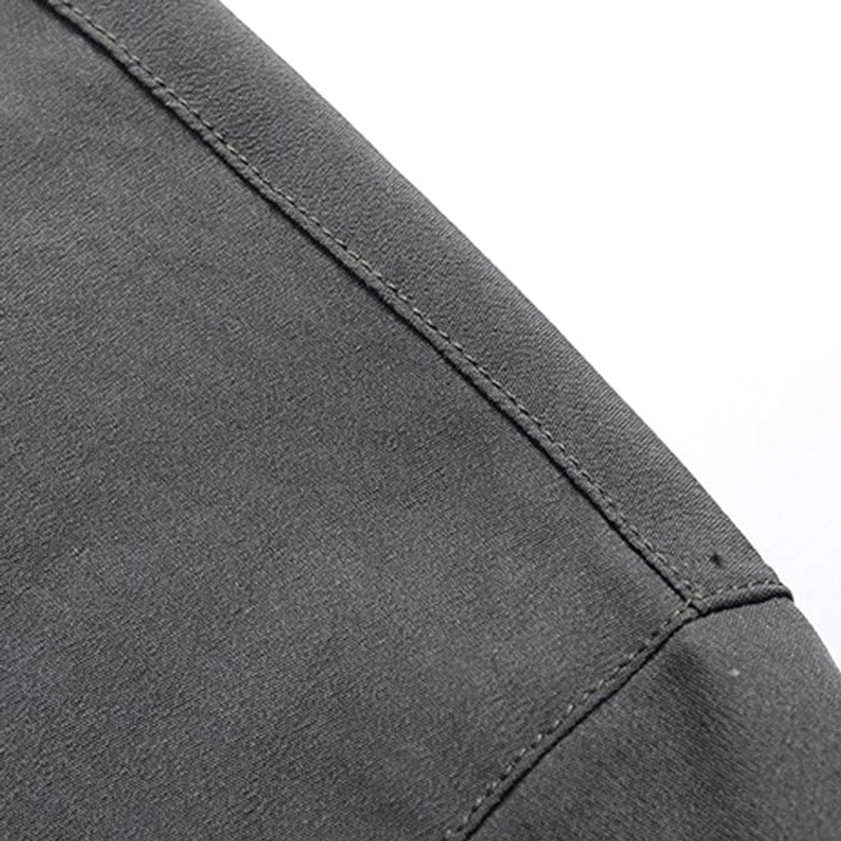 Tang suit sleeve detail with mandarin collar and embroidered cuff design, showcasing traditional Eastern tailoring techniques