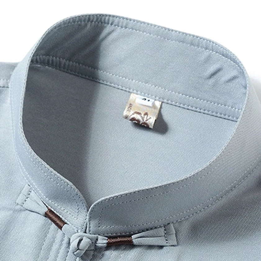 Tang suit mandarin collar detail with Chinese frog button and internal fabric tag