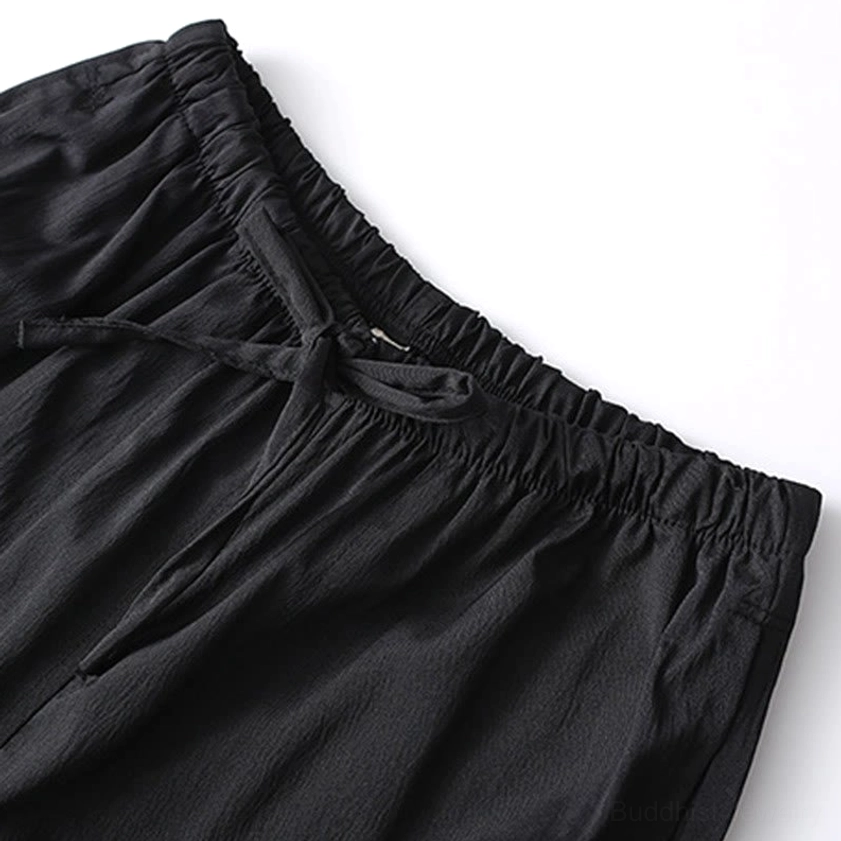 Tang suit trousers detail showing elastic waistband and side pocket construction