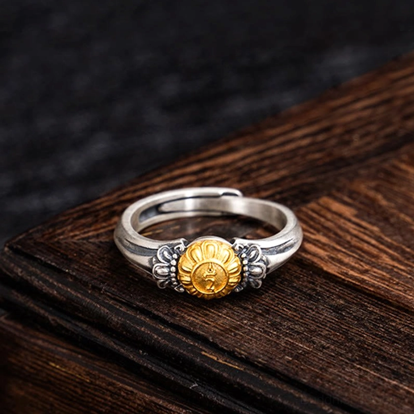 Top-down flat lay of Bodhisattva Tara adjustable ring showing symmetric decorative details and two-tone metal finish