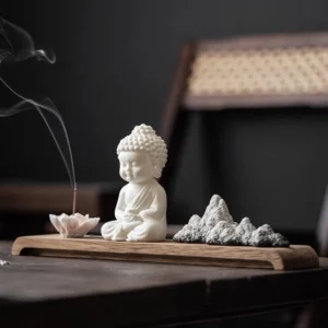 Tathagata Buddha ceramic incense burner with lotus holder on wooden tea table, Zen meditation decor