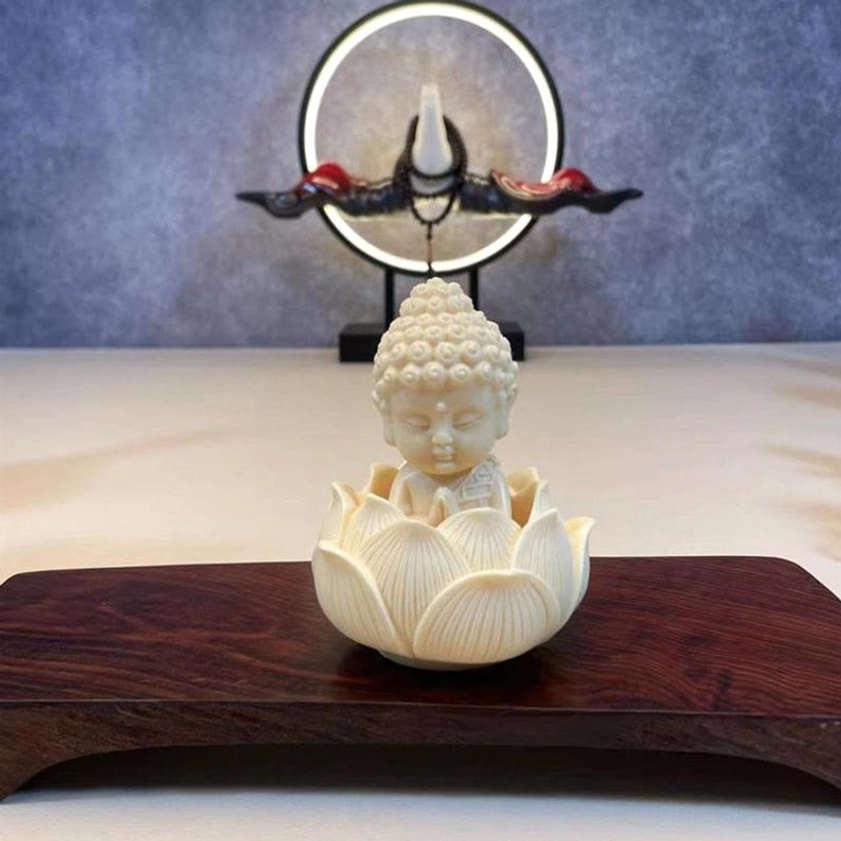 Tathagata Buddha figure seated on lotus base - natural ivory fruit carving