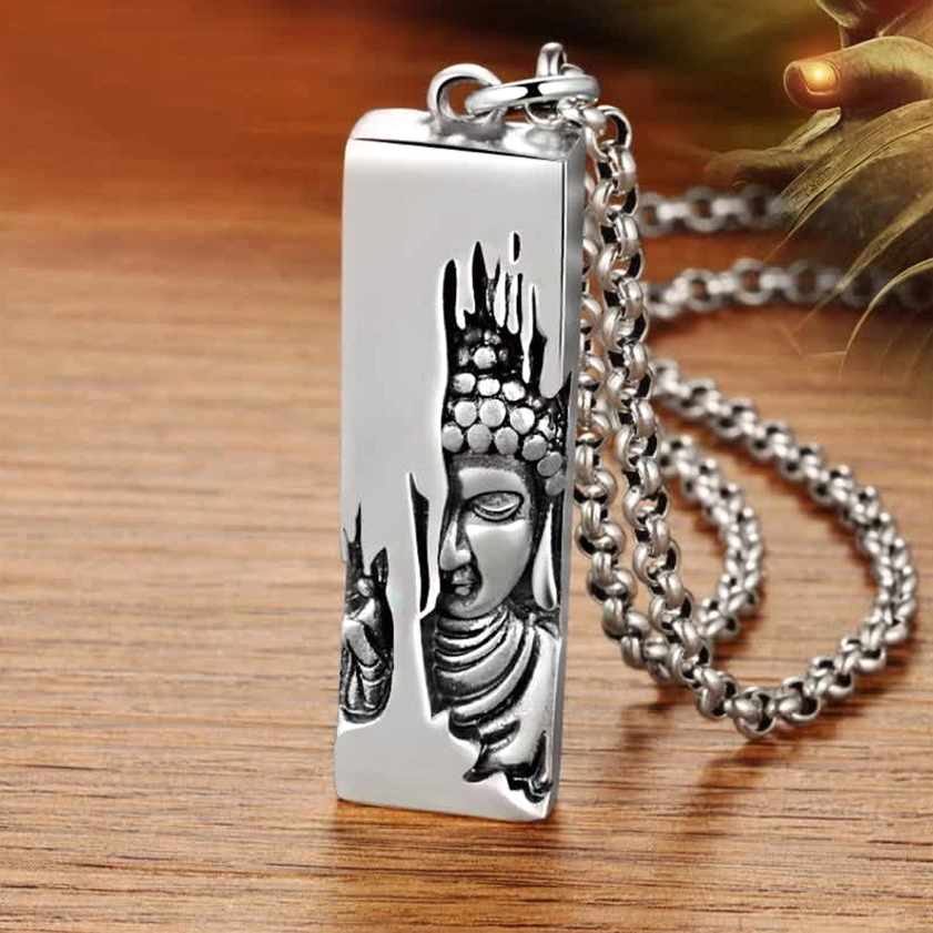 Tathagata Buddha pendant necklace close-up showing polished copper with handprint and Buddha relief design