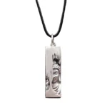Tathagata Buddha pendant necklace with black leather rope - front view showing detailed Buddha portrait relief on copper pendant
