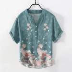 Teal lotus print cotton men's short sleeve shirt front view with stand collar and half button placket design