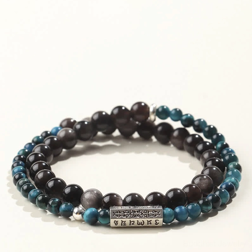 Silver Sheen Obsidian Buddhist bracelet with teal blue gradient beads, dark obsidian stone, and silver-toned sacred mantra ornament, double wrap design