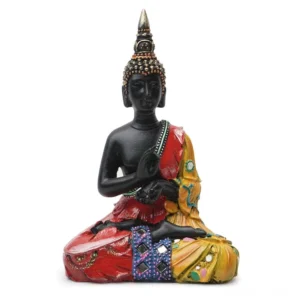 Thai Buddha resin statue front view with black body and red-yellow painted robes, studio photography