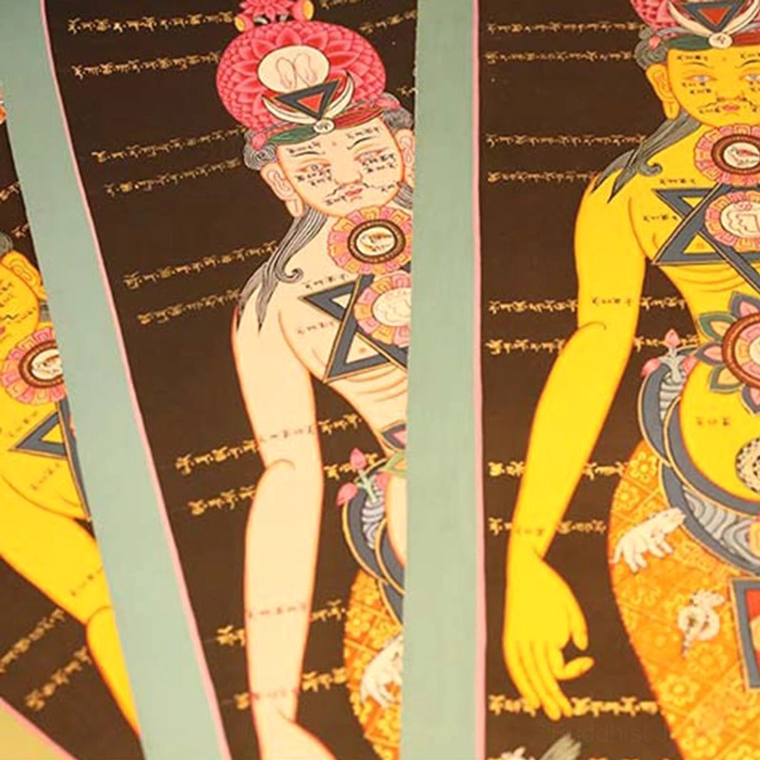 Close-up detail of thangka deity with pink ceremonial headdress Tibetan script and yellow sacred figure golden accents