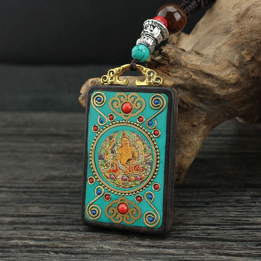Hand-painted thangka pendant with intricate enamel and metal inlay details - angled view