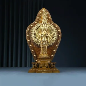 Thousand-armed Avalokitesvara bronze statue front view with ornate thousand-hand backdrop and decorative pedestal